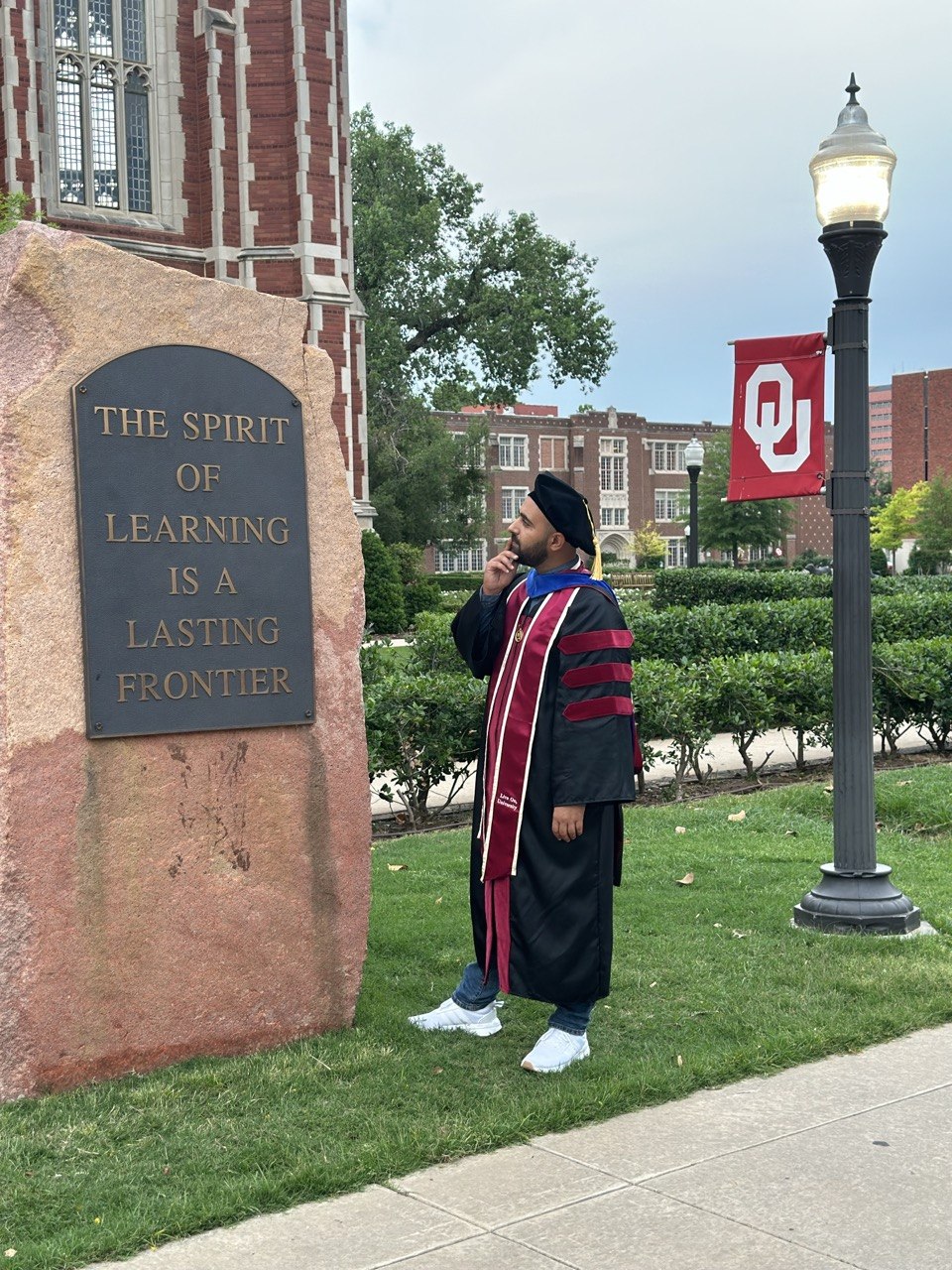 Peyman at the Spirit of Learning stone, OU campus